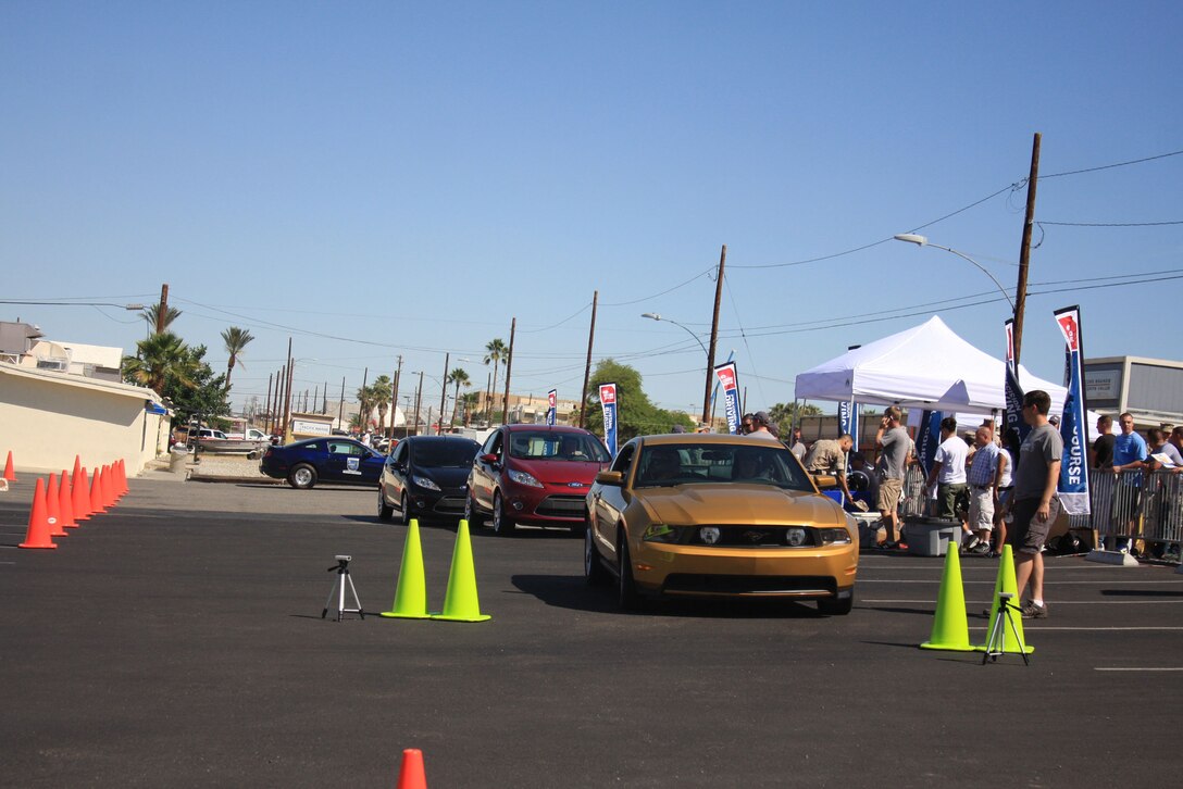 A Ford Mustang and two Ford Fiestas are lined up, ready for members of the Combat Center community to test drive them on the makeshift precision driving course across the street from the Main Exchange during the Ford: Operation Drive One event June 4. Ford is donating $20 for every test drive completed during their Operation Drive One events at various military installations across the nation to the National Military Family Association, up to $10,000.